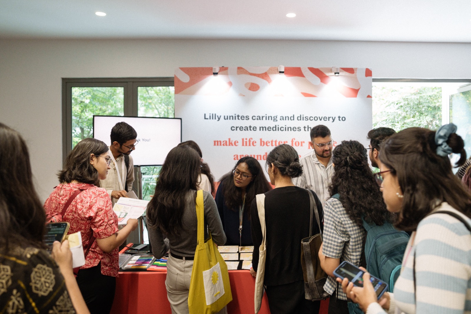 Audience interaction at Lilly's sponsor booth, VizChitra 2025.